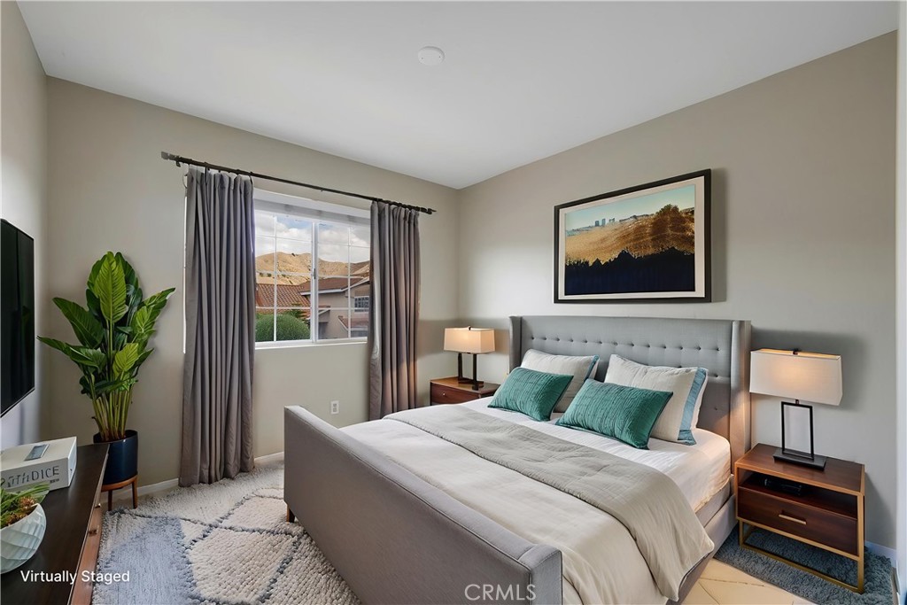 4817 Golden Ridge Drive Corona, CA 92878 - Photo 34 of 70 a bedroom with a bed and a painting on the wall