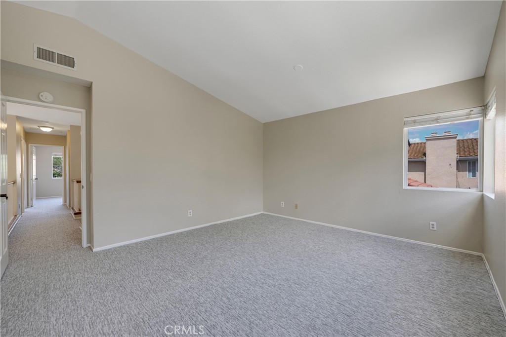 4817 Golden Ridge Drive Corona, CA 92878 - Photo 36 of 70 Primary bedroom at top of stairs has high cathedral ceiling.