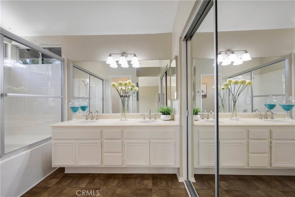 4817 Golden Ridge Drive Corona, CA 92878 - Photo 46 of 70 a bathroom with a sink and a mirror