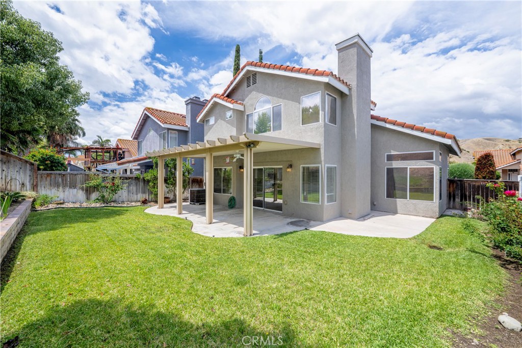 4817 Golden Ridge Drive Corona, CA 92878 - Photo 51 of 70 a front view of a house with a yard and porch