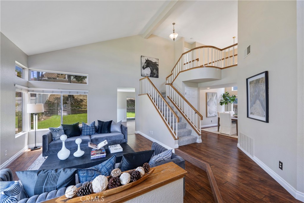 4817 Golden Ridge Drive Corona, CA 92878 - Photo 6 of 70 a living room with furniture stairs and a large window