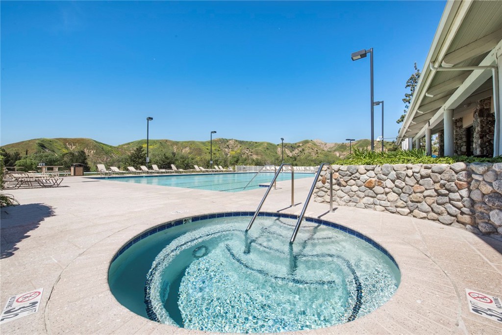 4817 Golden Ridge Drive Corona, CA 92878 - Photo 65 of 70 a view of a swimming pool with a yard
