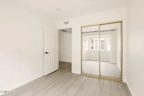 a view of an empty room with glass door