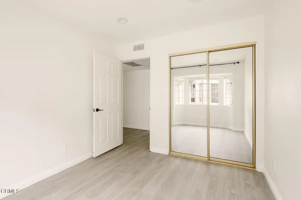 a view of an empty room with glass door