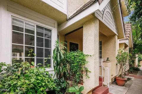 a view of a potted plants in front of a house