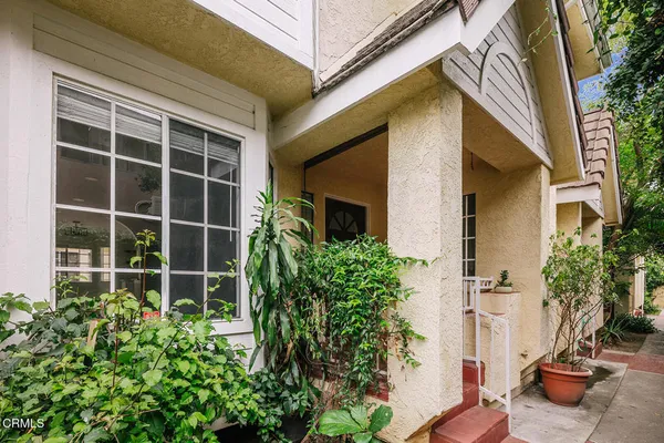 a view of a potted plants in front of a house