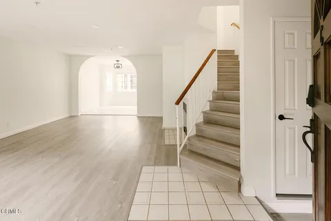 a view of entryway with wooden floor