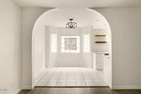 a view of an entryway with table and window