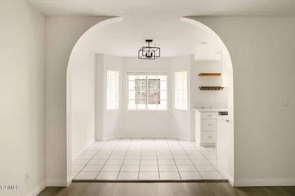 a view of an entryway with table and window