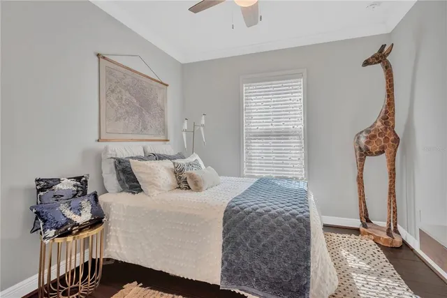 a room with furniture a flat screen tv and a window