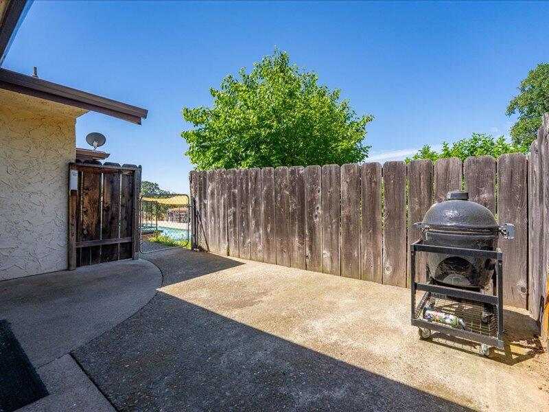 19907 Hidden Hills Road Cottonwood, CA 96022 - Photo 17 of 21 a view of backyard with wooden fence and trees
