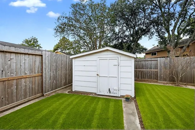 a view of a backyard with a garden