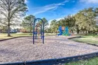 a view of outdoor space with playground and green space