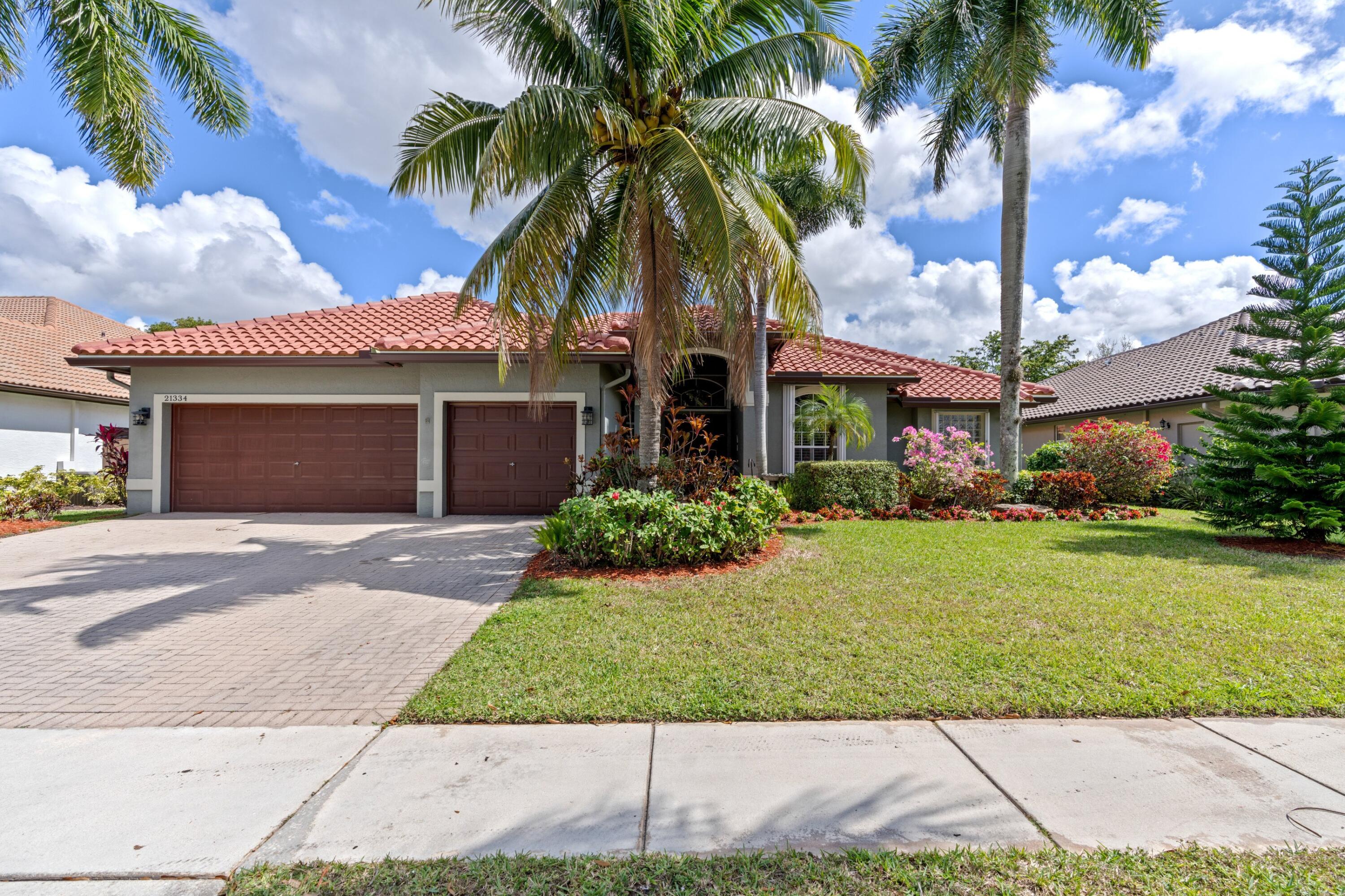 21334 Falls Ridge Way Boca Raton, FL 33428 - Photo 1 of 22 front view of a house with a yard