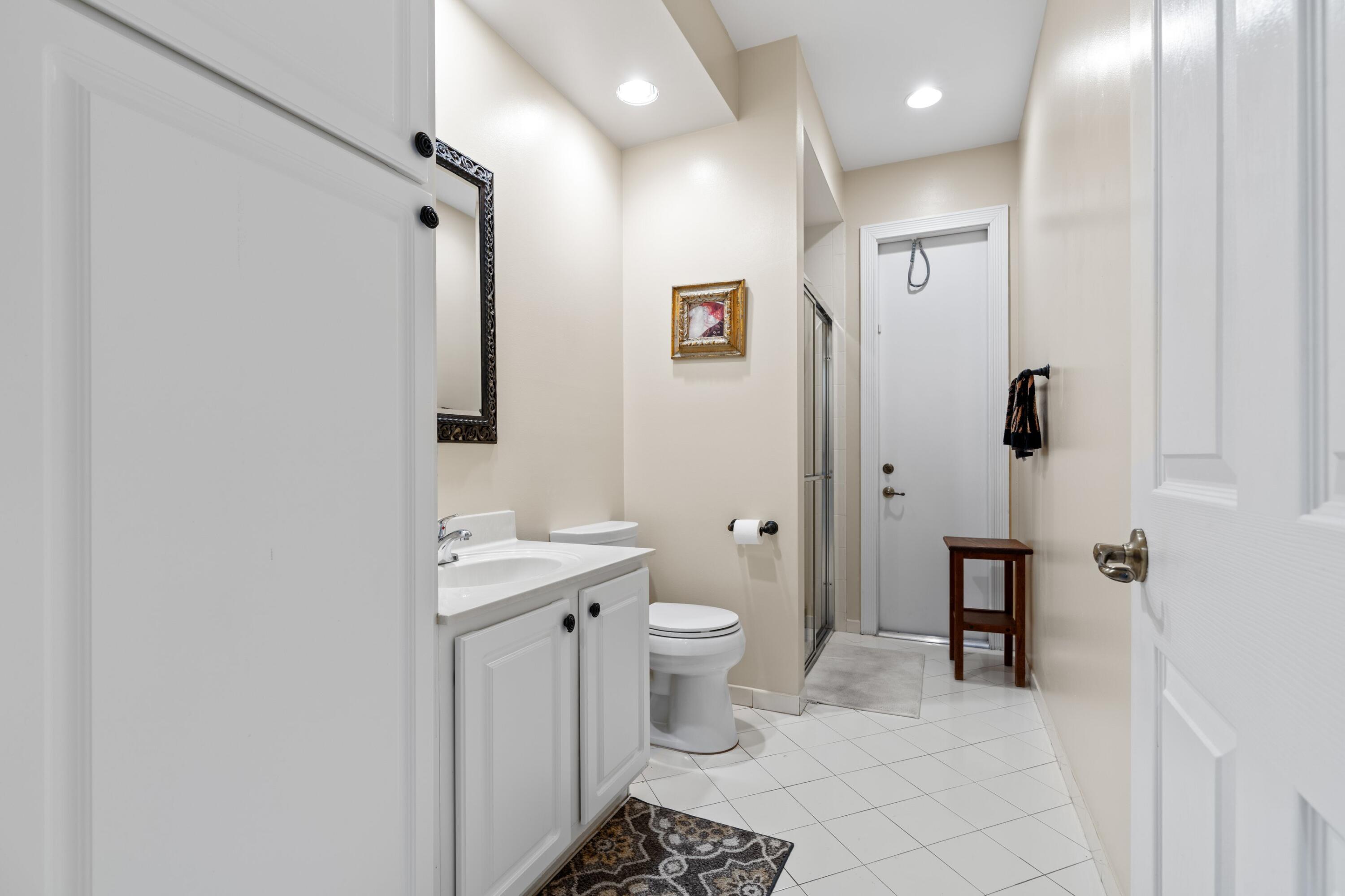 21334 Falls Ridge Way Boca Raton, FL 33428 - Photo 20 of 22 a bathroom with a sink a toilet and shower
