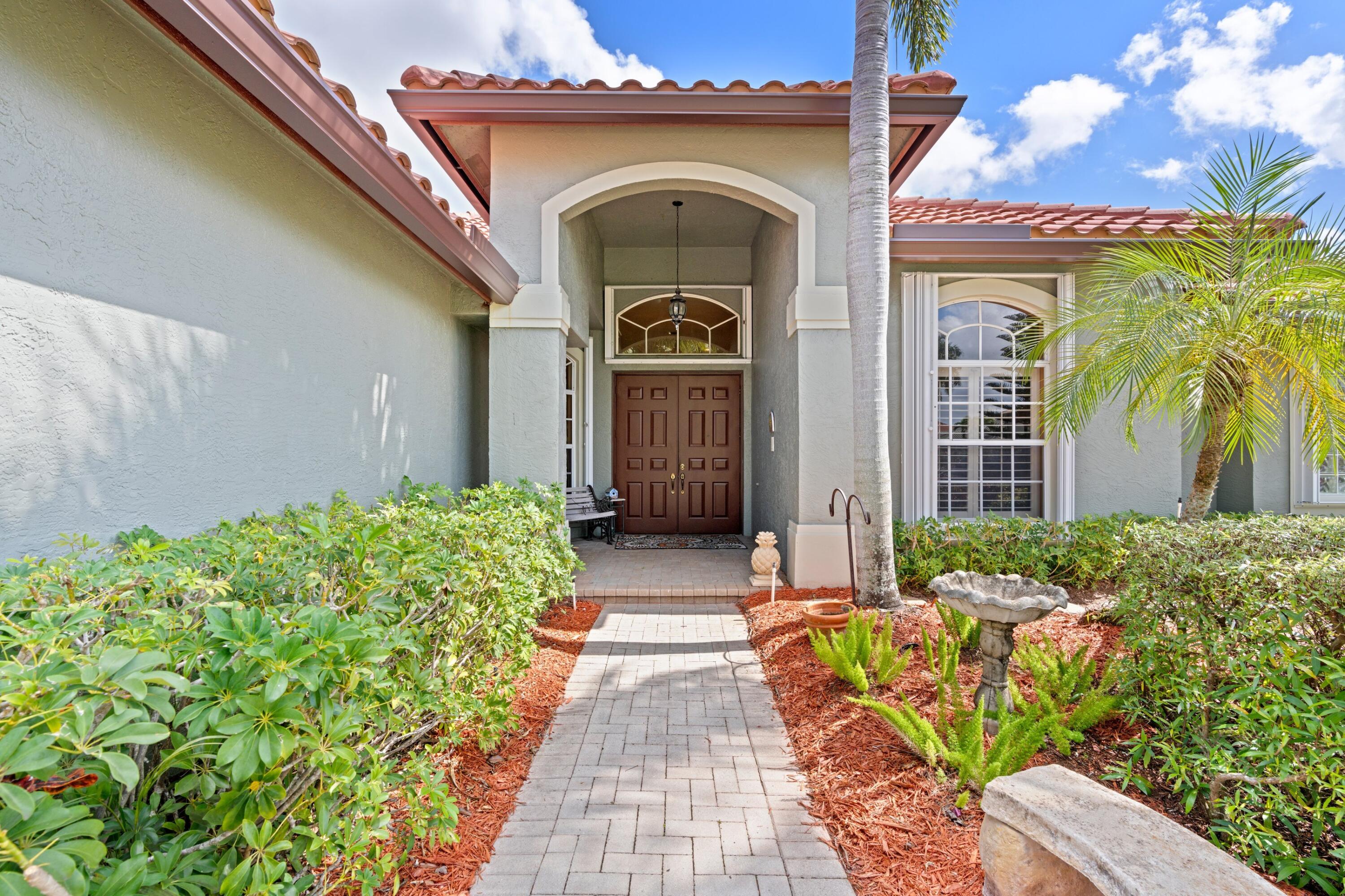 21334 Falls Ridge Way Boca Raton, FL 33428 - Photo 5 of 22 a front view of a house