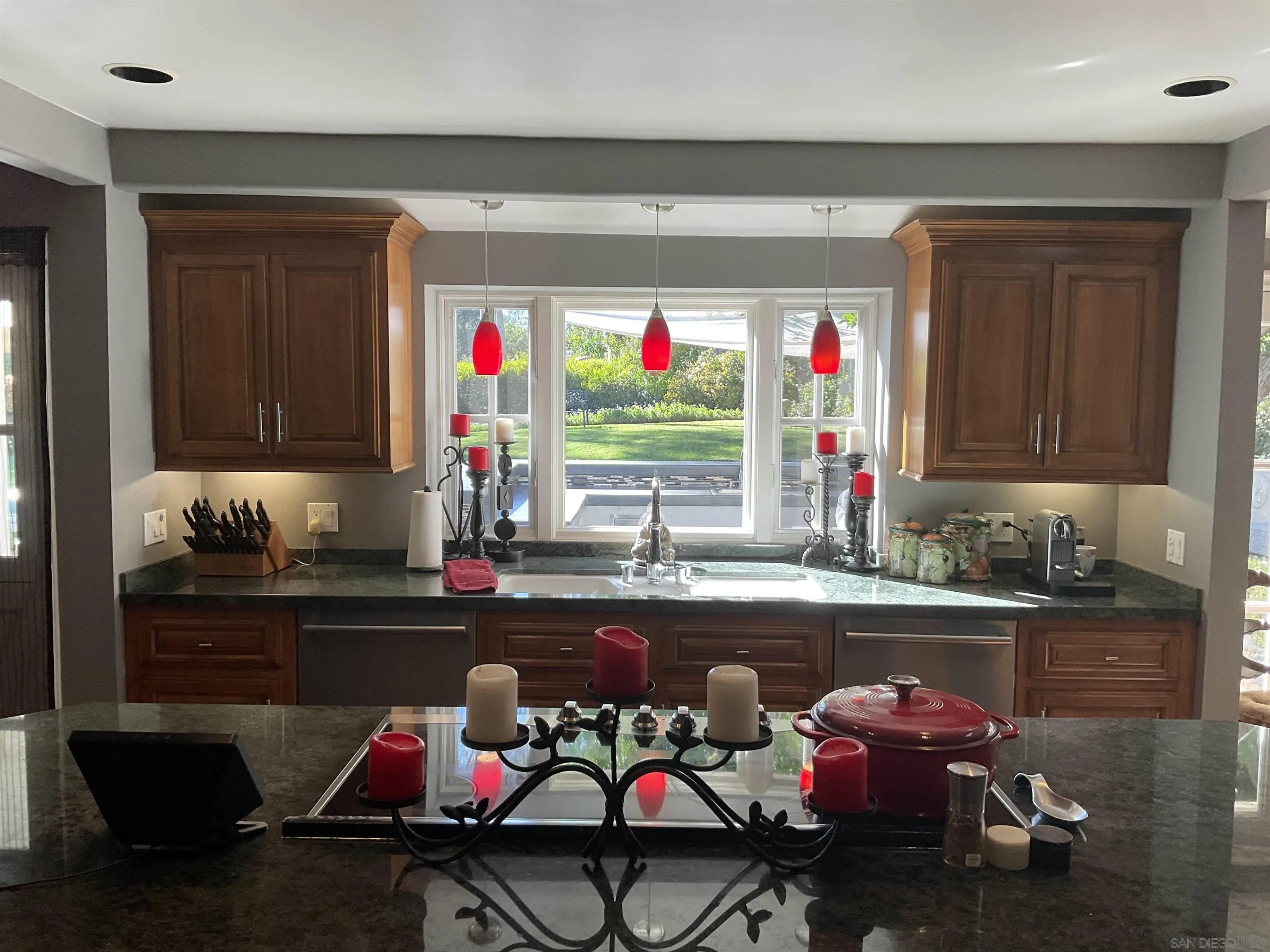 17532 Los Eucaliptos Rancho Santa Fe, CA 92067 - Photo 14 of 39 a kitchen with a sink and a stove top oven