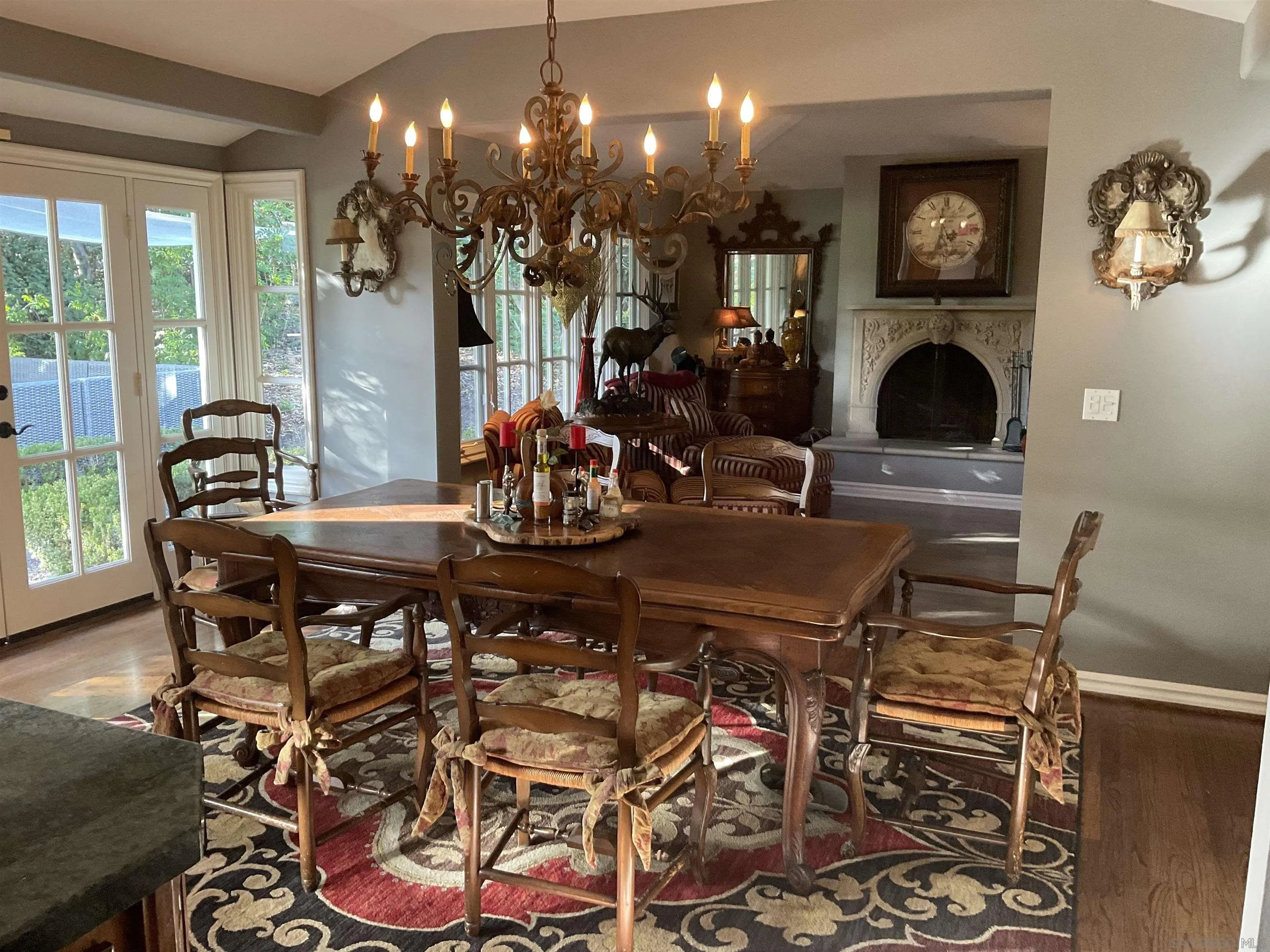 17532 Los Eucaliptos Rancho Santa Fe, CA 92067 - Photo 15 of 39 a view of a dining room with furniture and chandelier