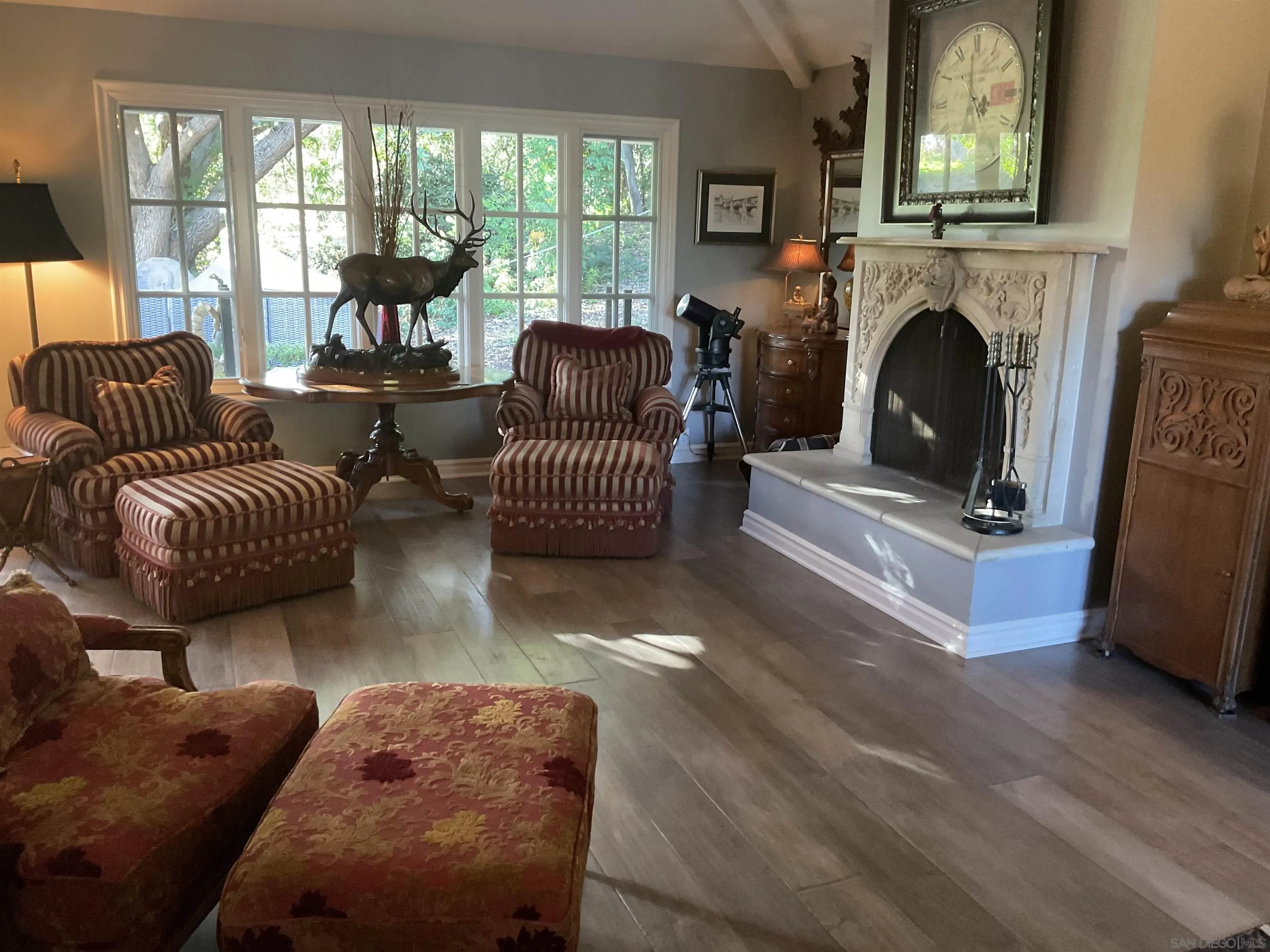 17532 Los Eucaliptos Rancho Santa Fe, CA 92067 - Photo 16 of 39 a living room with furniture and a fireplace
