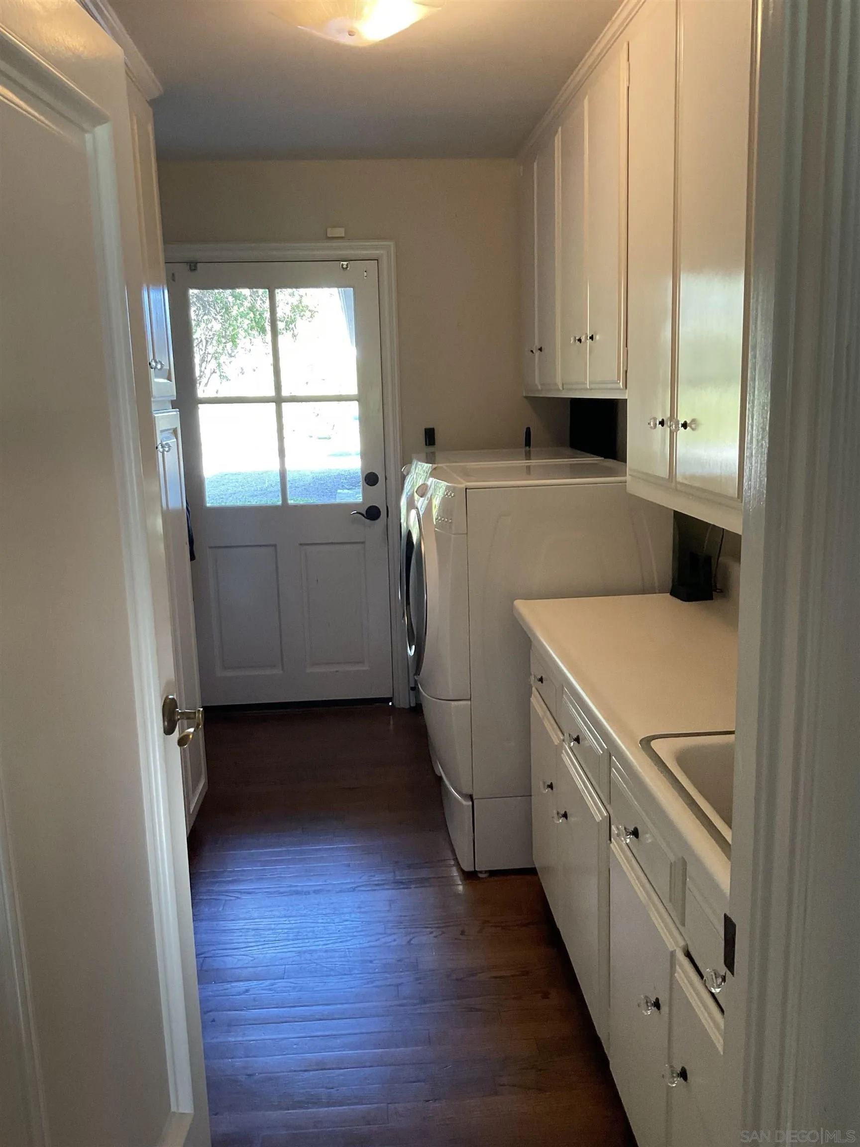 17532 Los Eucaliptos Rancho Santa Fe, CA 92067 - Photo 18 of 39 a utility room with wooden floor washer and dryer