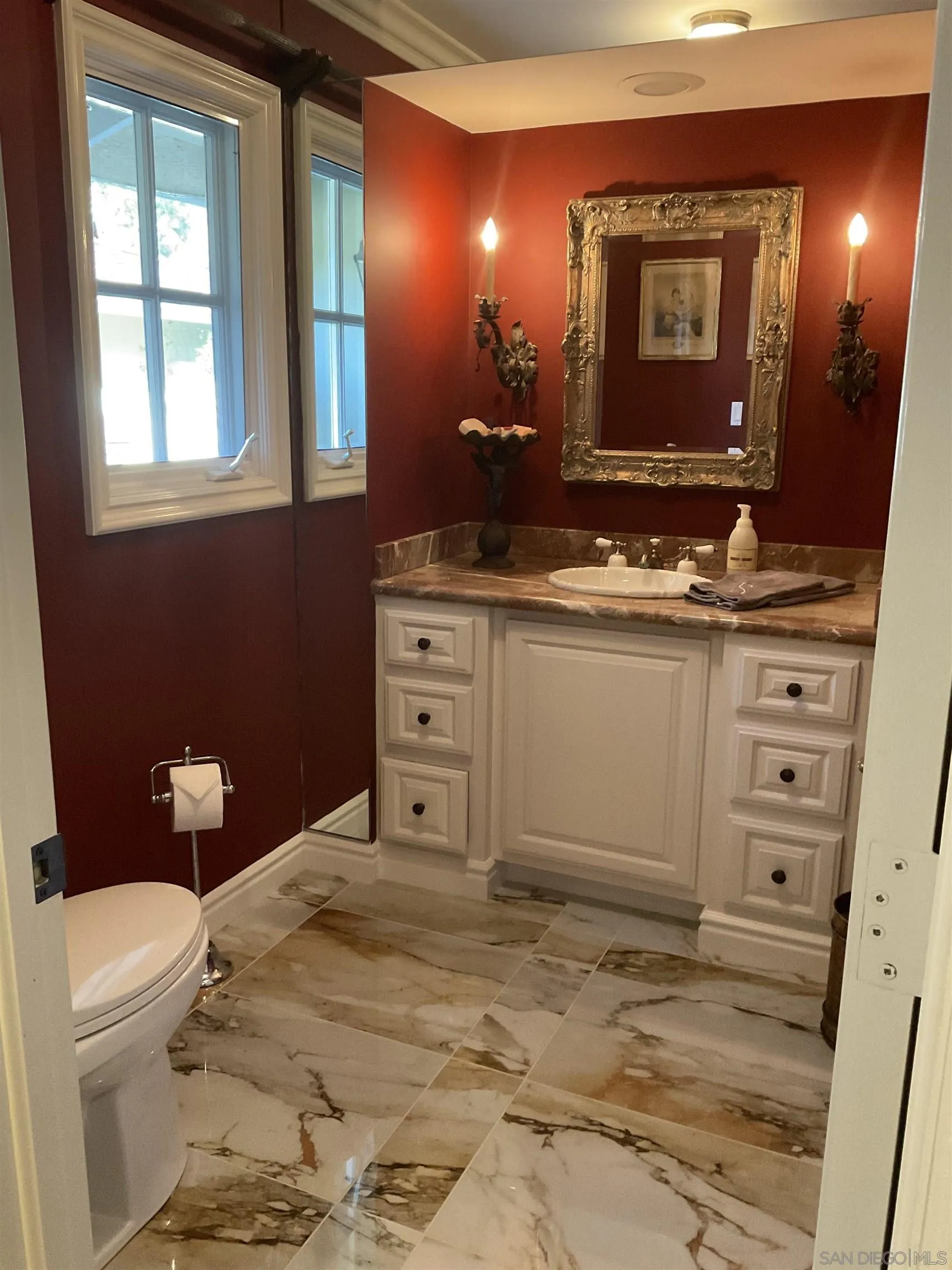 17532 Los Eucaliptos Rancho Santa Fe, CA 92067 - Photo 29 of 39 a bathroom with a toilet sink and mirror