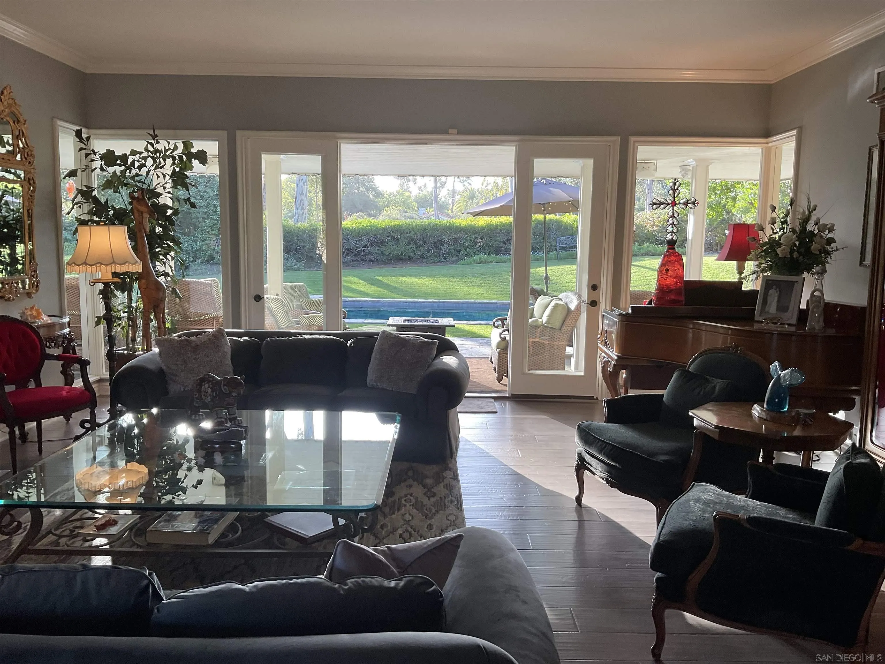 17532 Los Eucaliptos Rancho Santa Fe, CA 92067 - Photo 8 of 39 a living room with furniture and a floor to ceiling window