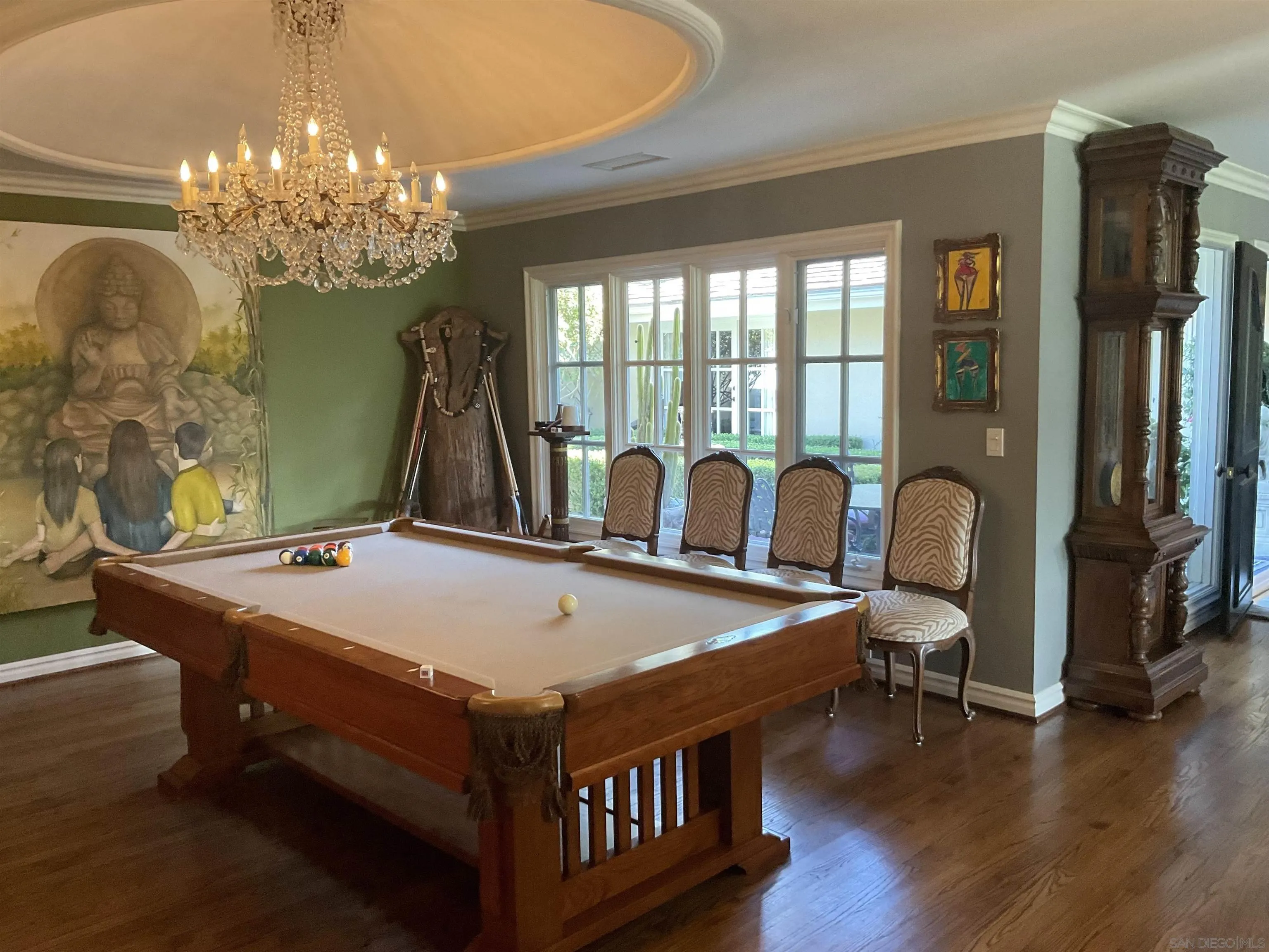 17532 Los Eucaliptos Rancho Santa Fe, CA 92067 - Photo 9 of 39 a bed room with furniture and a chandelier