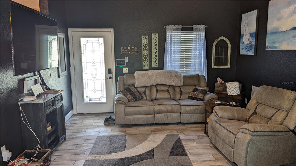 3101 Fallow Road Venice, FL 34293 - Photo 11 of 18 a living room with furniture and a window