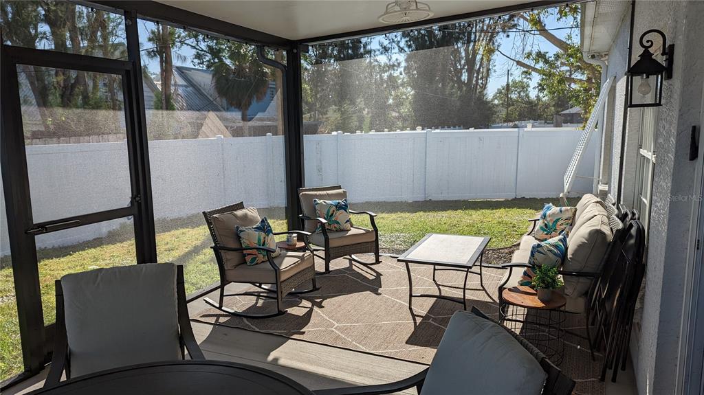 3101 Fallow Road Venice, FL 34293 - Photo 14 of 18 a view of a chairs and table in patio with a backyard