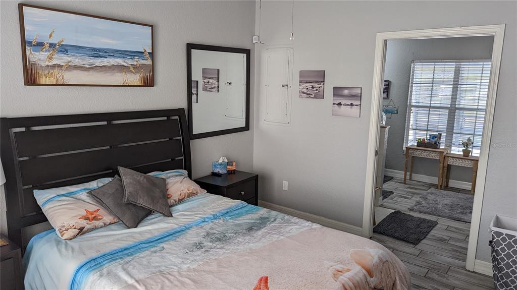 3101 Fallow Road Venice, FL 34293 - Photo 6 of 18 a bedroom with a bed and the view of kitchen