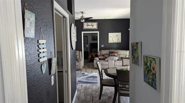 a view of a hallway with seating area