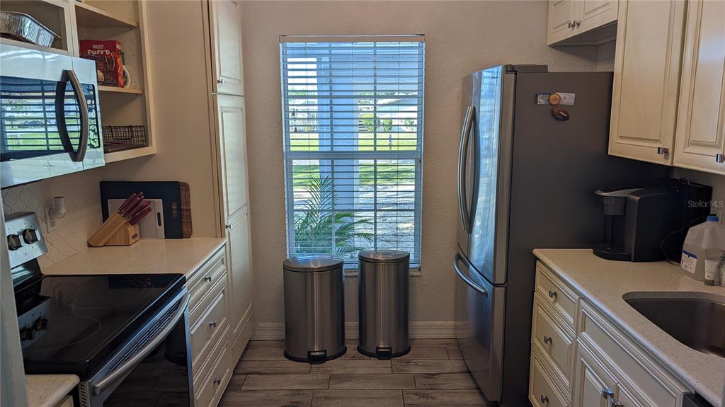 3101 Fallow Road Venice, FL 34293 - Photo 8 of 18 a kitchen with stainless steel appliances granite countertop a refrigerator and a stove