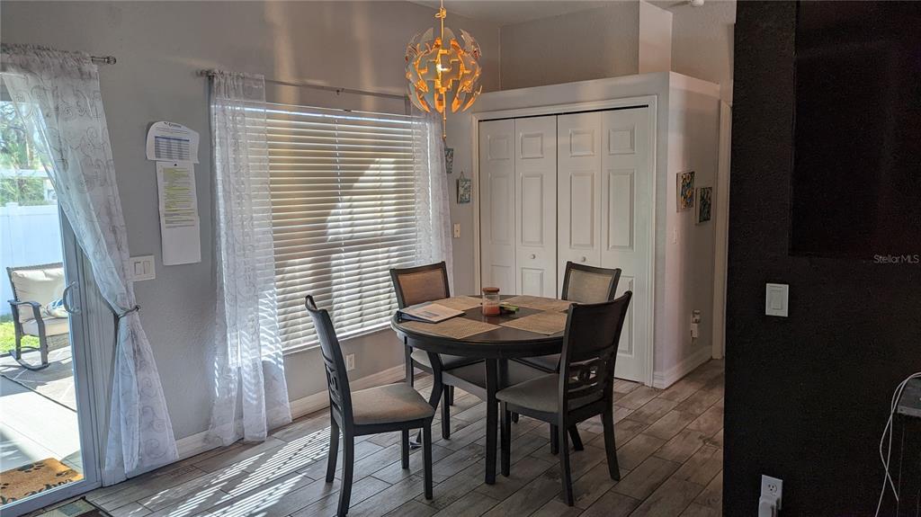 3101 Fallow Road Venice, FL 34293 - Photo 10 of 18 a view of a dining room with furniture and window