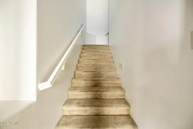 a kitchen with stainless steel appliances granite countertop a sink and cabinets with wooden floor