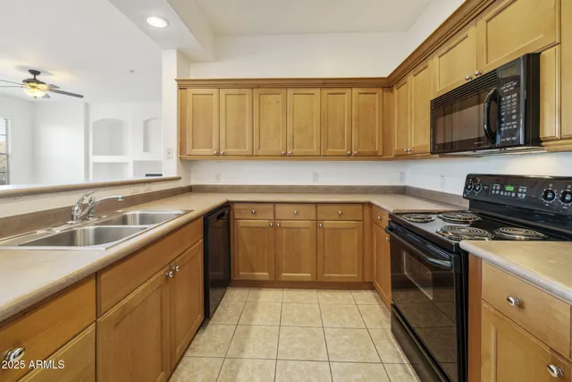 a kitchen with a refrigerator and cabinets