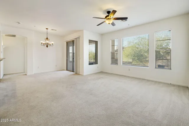 a spacious bathroom with a double vanity sink and mirror