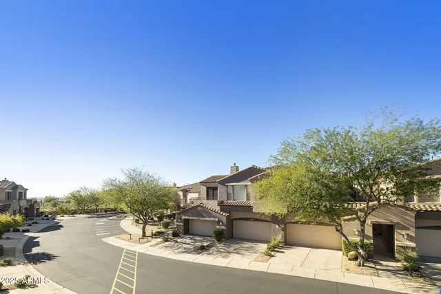 a view of a street with a building in the background