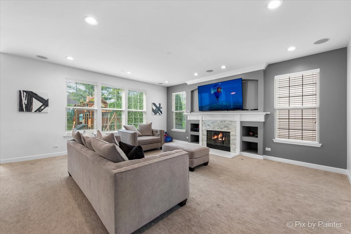 5919 Chatham Drive Hoffman Estates, IL 60192 - Photo 12 of 52 a living room with furniture and a fireplace