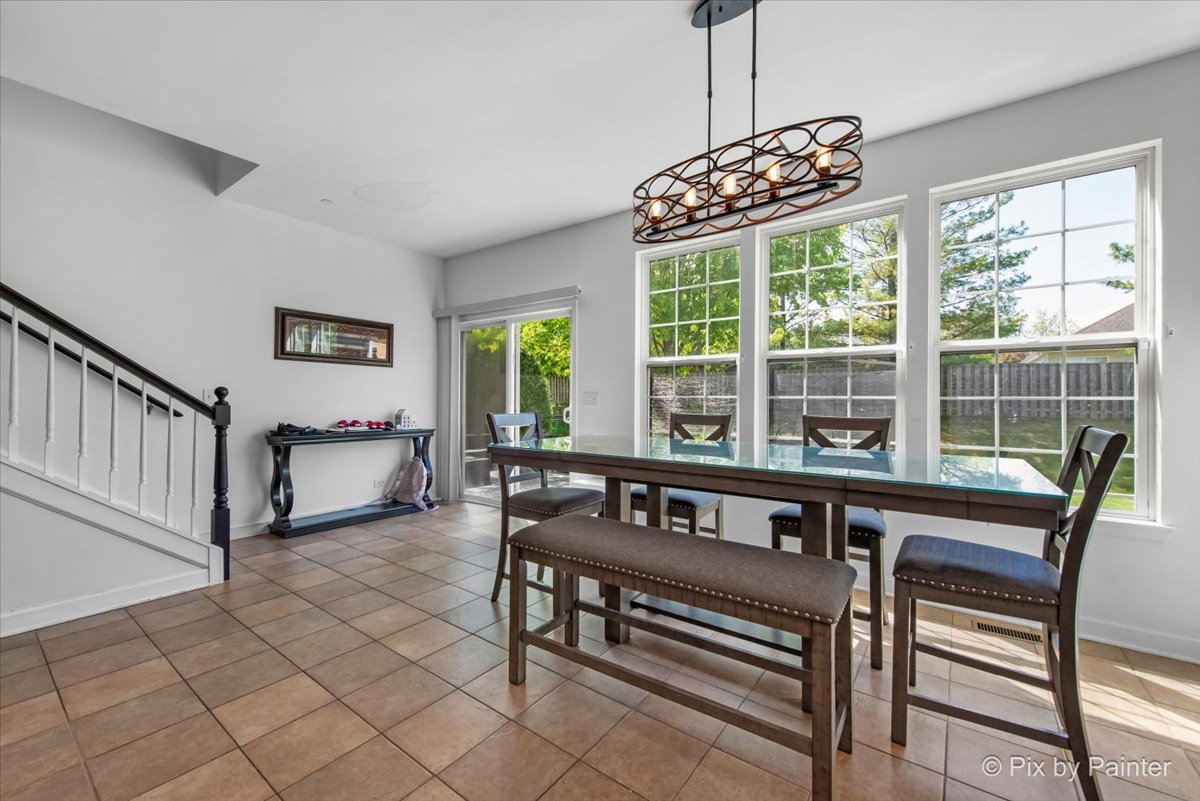 5919 Chatham Drive Hoffman Estates, IL 60192 - Photo 18 of 52 a view of a room with furniture windows and wooden floor