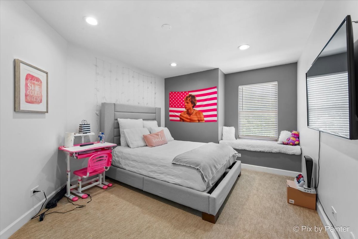 5919 Chatham Drive Hoffman Estates, IL 60192 - Photo 26 of 52 a bedroom with a bed and windows