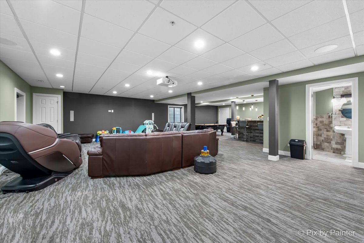 5919 Chatham Drive Hoffman Estates, IL 60192 - Photo 30 of 52 a living room with furniture and a wooden floor