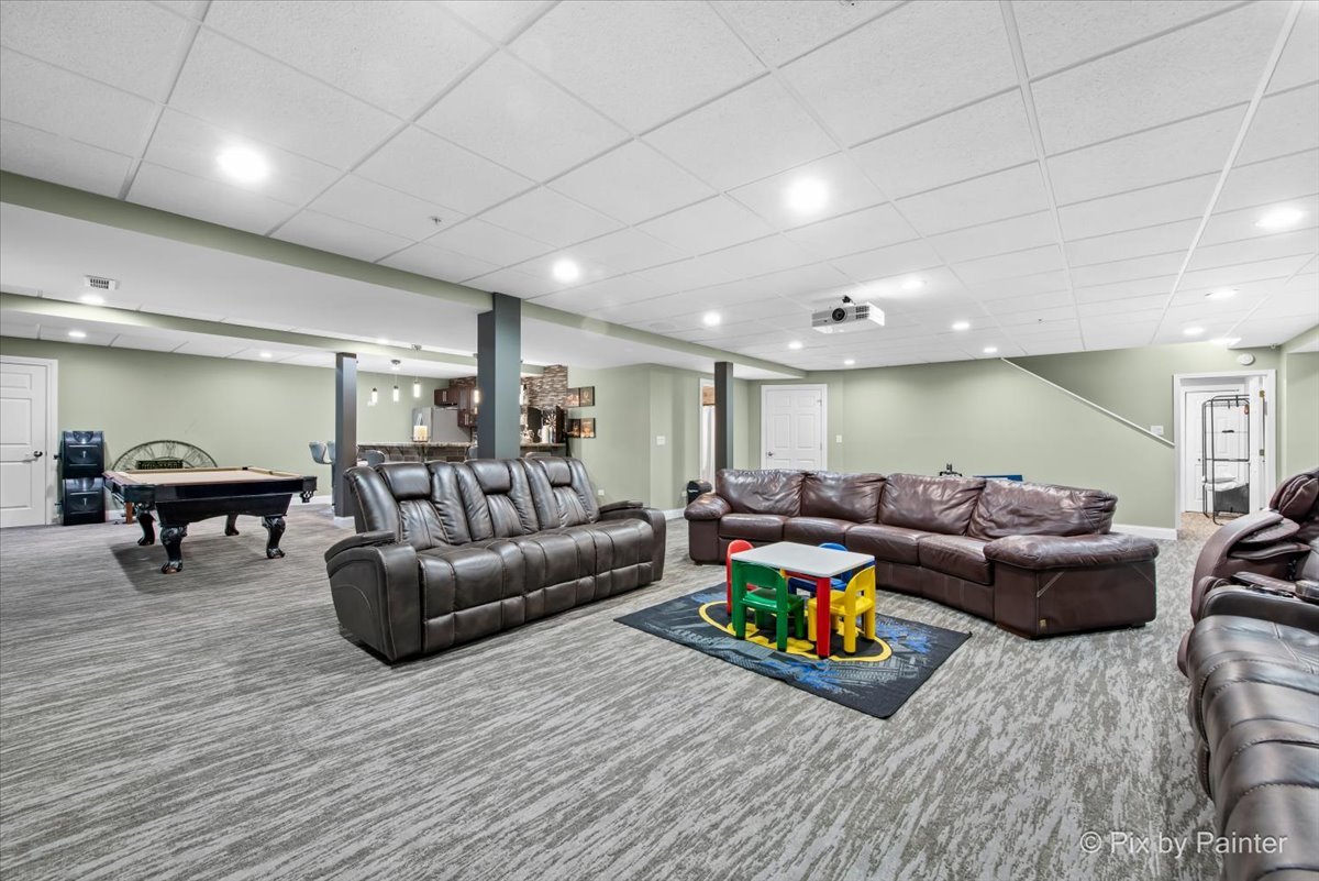 5919 Chatham Drive Hoffman Estates, IL 60192 - Photo 33 of 52 a living room with furniture and a wooden floor