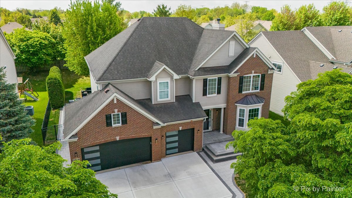5919 Chatham Drive Hoffman Estates, IL 60192 - Photo 38 of 52 an aerial view of a house with a yard
