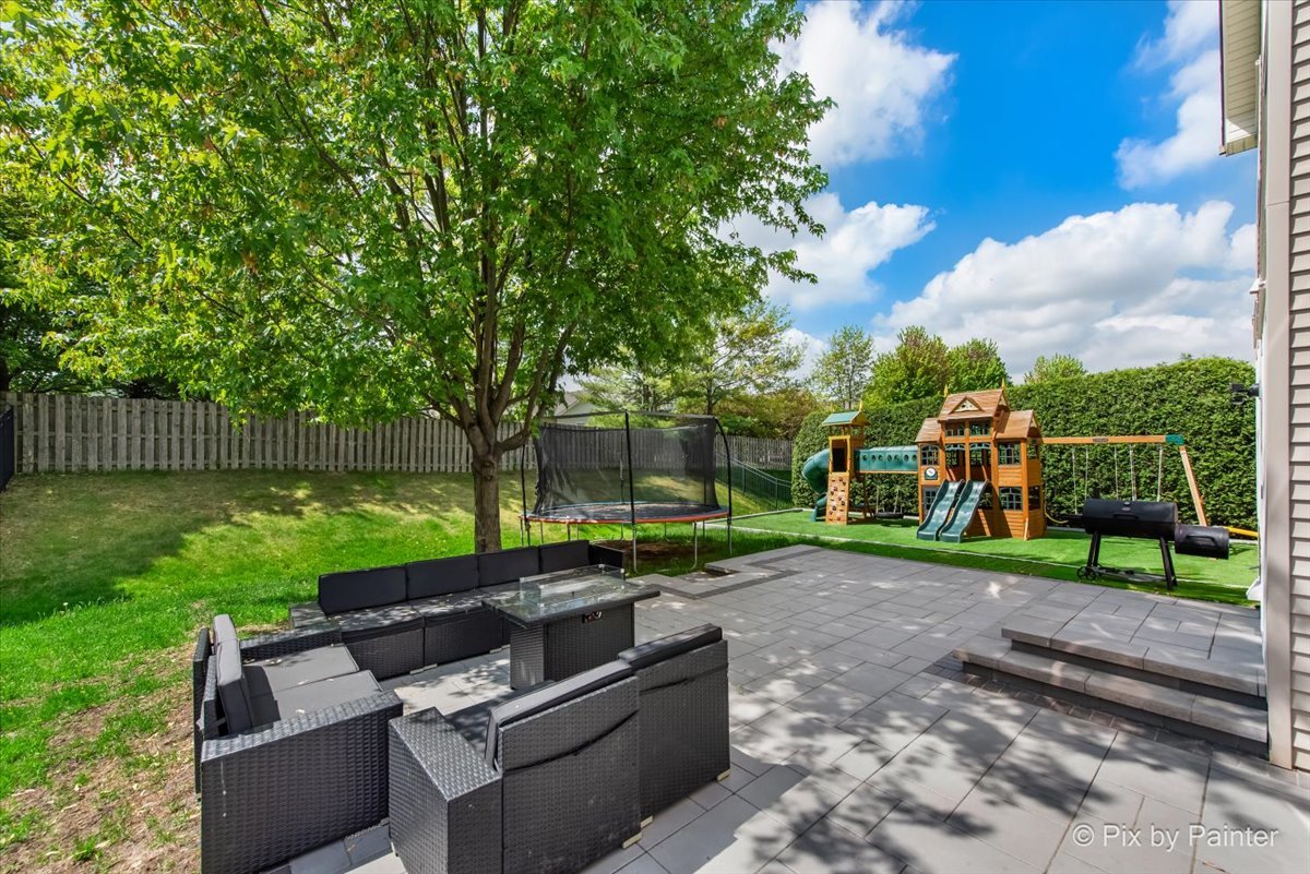 5919 Chatham Drive Hoffman Estates, IL 60192 - Photo 4 of 52 a view of backyard with seating area and green space