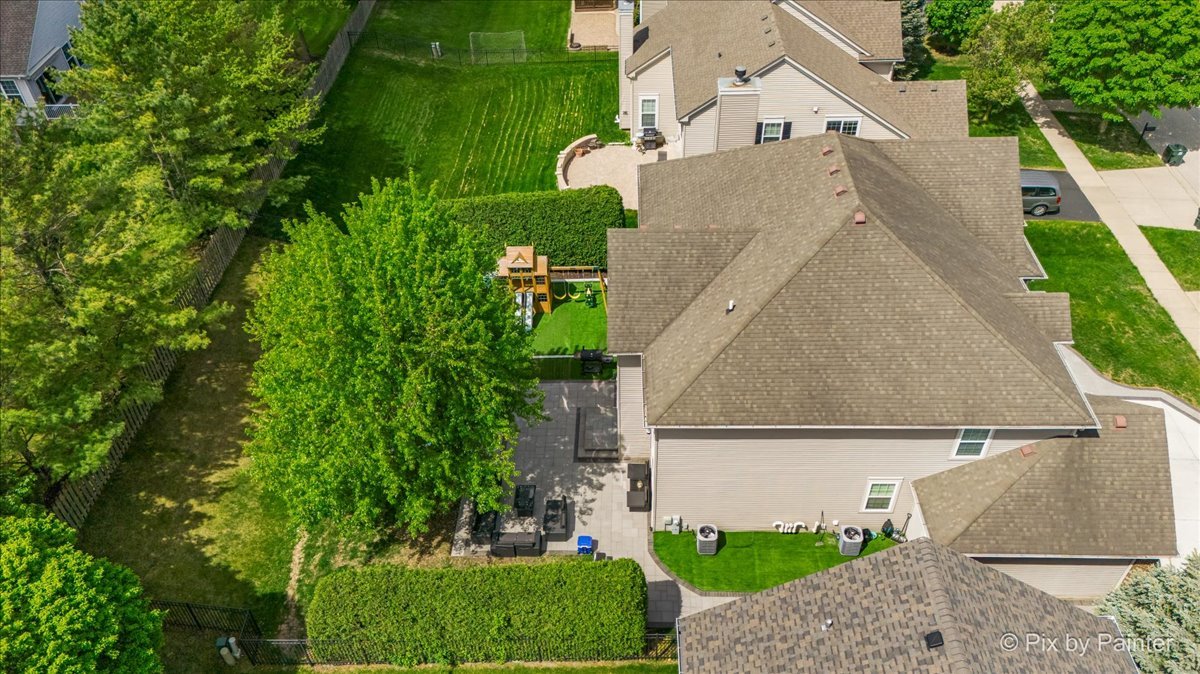 5919 Chatham Drive Hoffman Estates, IL 60192 - Photo 46 of 52 an aerial view of a house with a yard and a garage