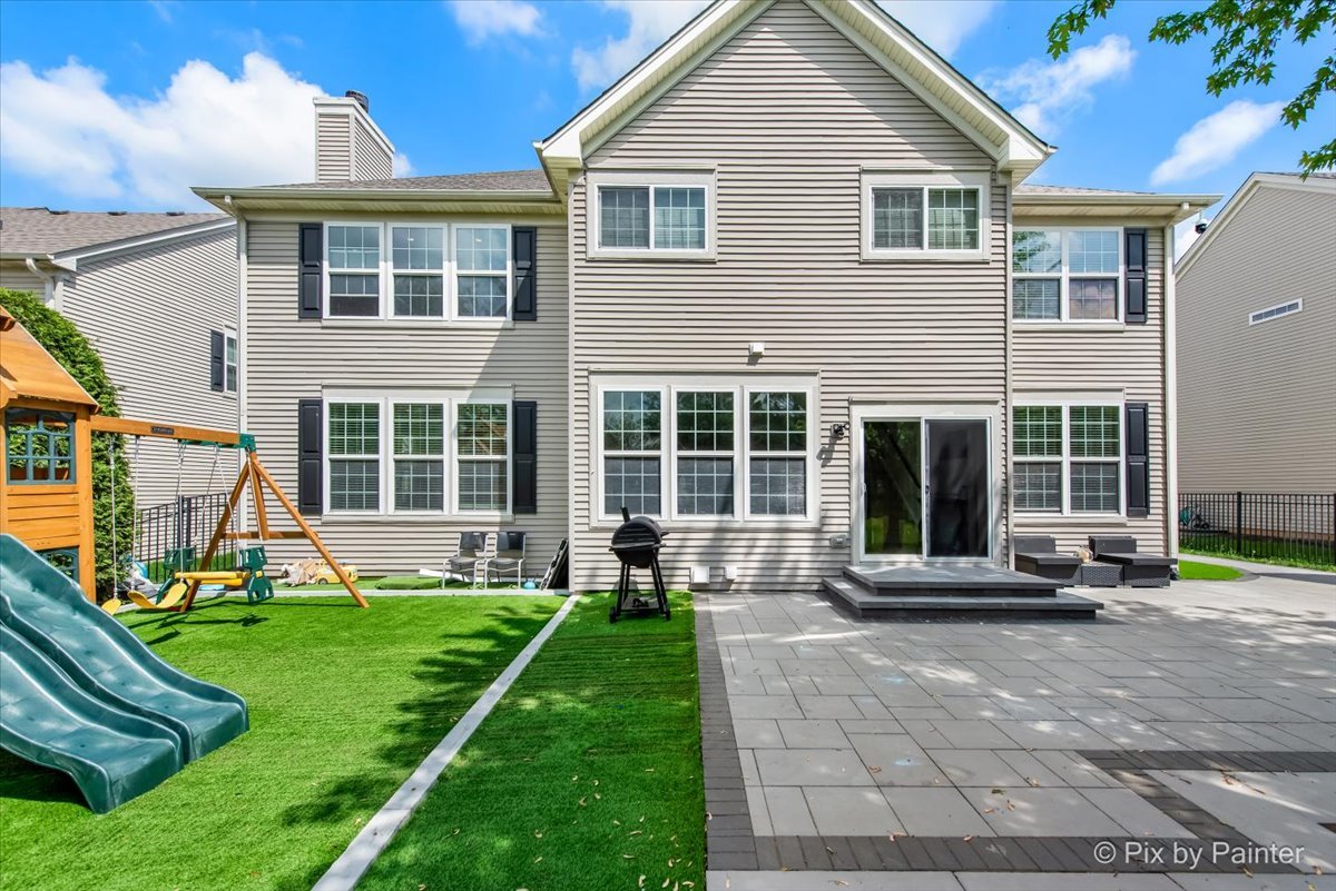 5919 Chatham Drive Hoffman Estates, IL 60192 - Photo 6 of 52 a front view of a house with a yard and porch