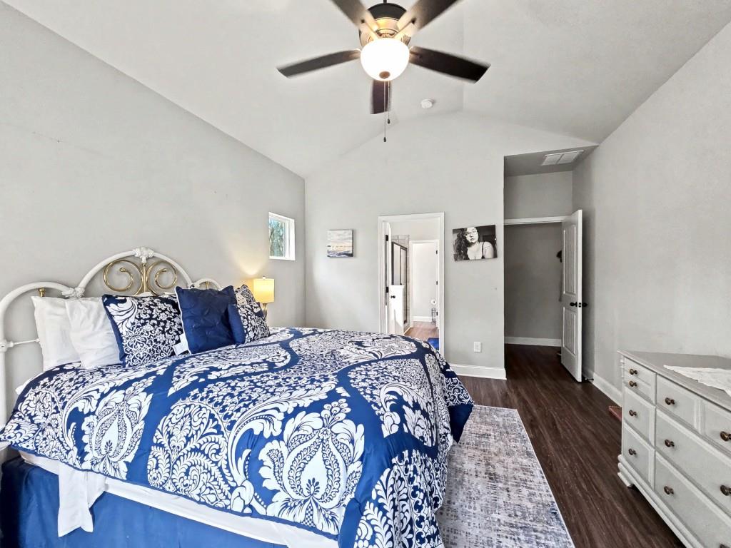 453 Mulberry Rock Road Temple, GA 30179 - Photo 16 of 35 a bedroom with a large bed and a chandelier
