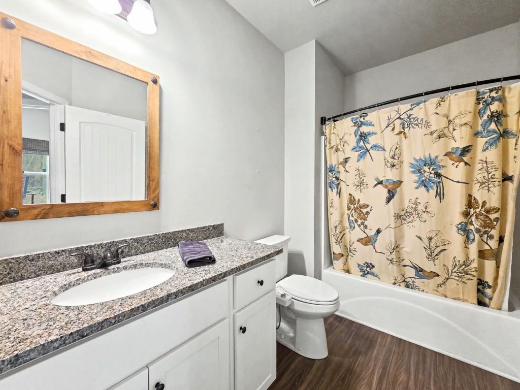 453 Mulberry Rock Road Temple, GA 30179 - Photo 23 of 35 a bathroom with a granite countertop sink toilet and shower
