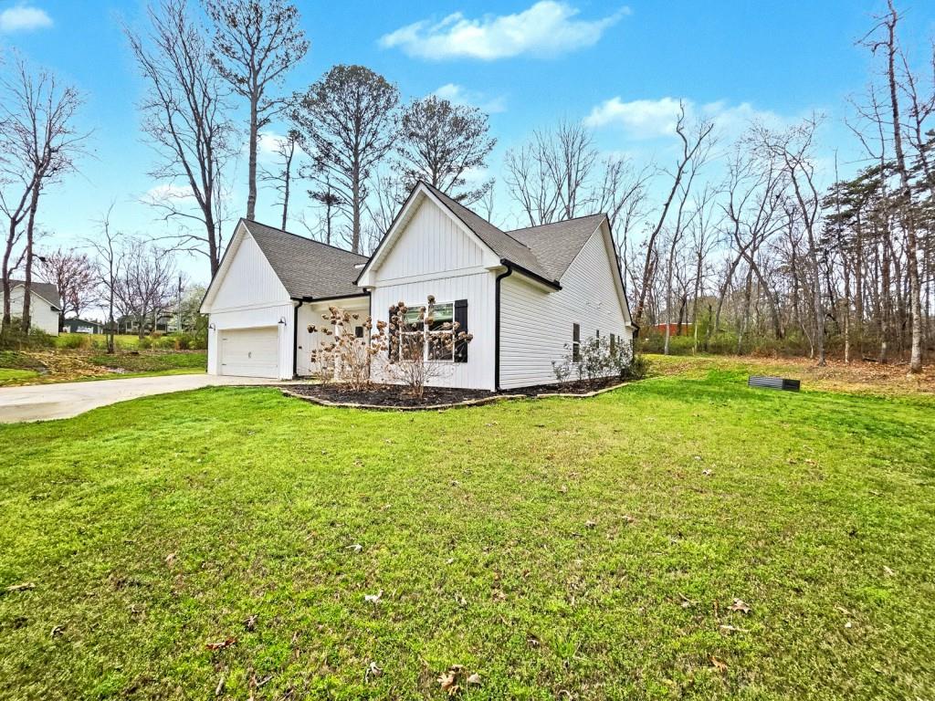 453 Mulberry Rock Road Temple, GA 30179 - Photo 3 of 35 a view of a house with garden and trees