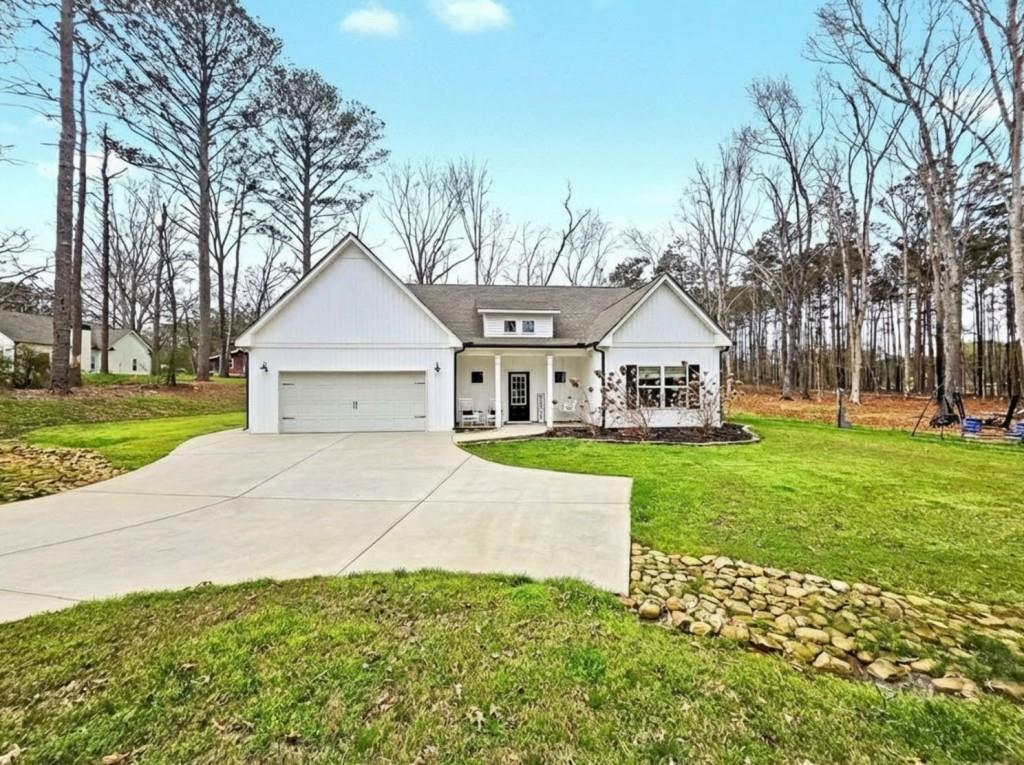 453 Mulberry Rock Road Temple, GA 30179 - Photo 34 of 35 a view of a house with a yard